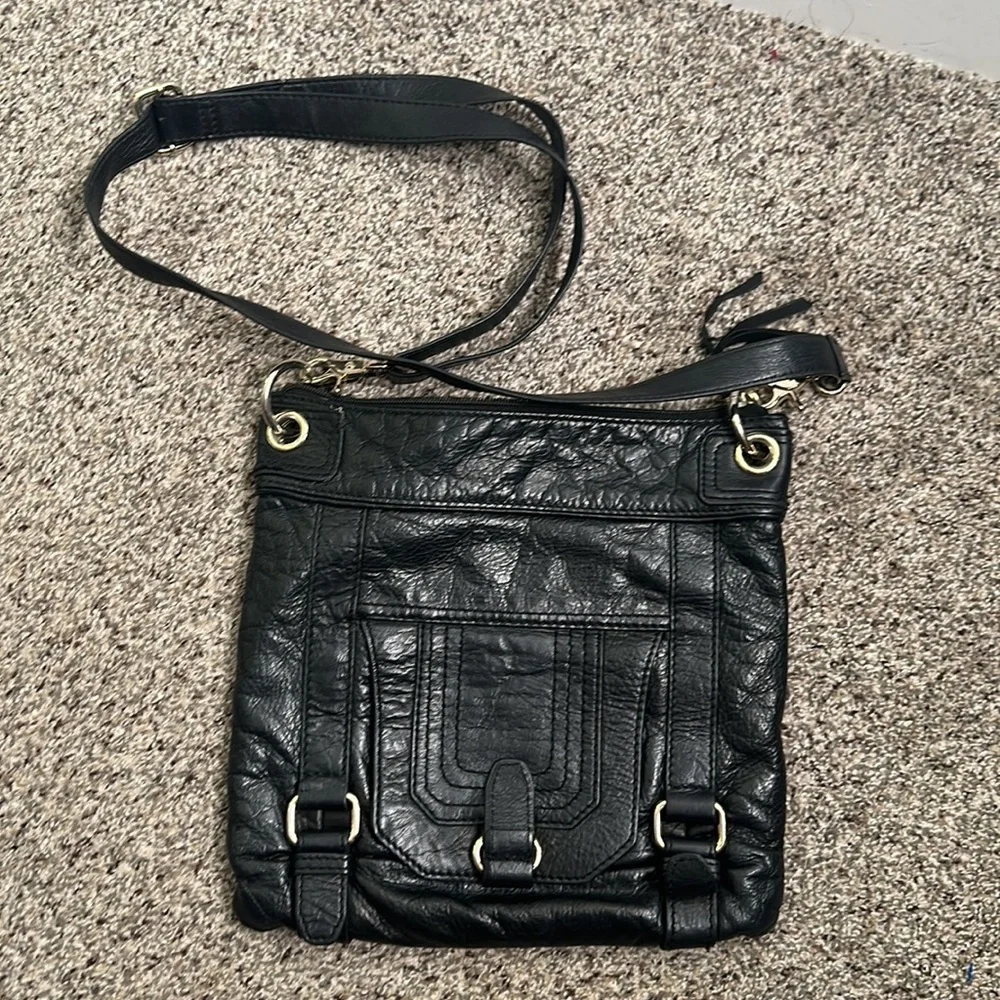The Saks black leather cross body bag